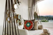 18 hanging outdoor bed on ropes for a boho-inspired outdoor space