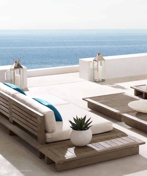 pallet wooden seating with white cushions and pillows for a simple clean look