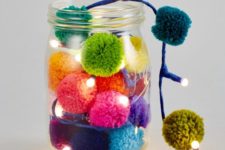04 a jar with a garland of colorful pompoms and LED lights for summer decor