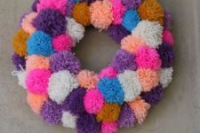 05 a bold pompom wreath is an easy and long-lasting summer wreath idea