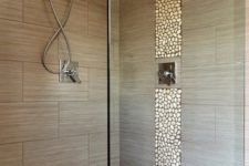 05 accentuate the shower space with a pebble line and a pebble floor