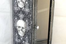 06 a black and white skull cabinet can be easily DIYed with adhesive wallpaper