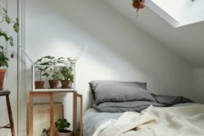 06 a cozy natural attic bedroom with a skylight lets enjoying sunlight in the morning