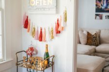 07 a colorful tassel garland to accentuate your home bar