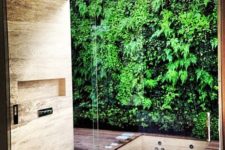 07 a glazed wall and a living wall outside lets you feel having a shower outside and without anybody’s eyes