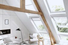 07 a large Scandinavian bedroom with large window skylights that highlight the double height ceiling