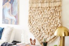 08 a neutral tassel hanging on the wall to add a cool boho feel to the interior