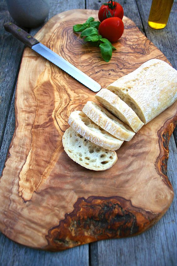 such a rustic rough wood slice serving and cutting board is great for any party and looks spectacular