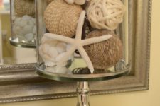 09 a cloche with a star fish, shell covered balls and jute balls