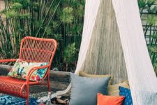 11 a sheer teepee with a couple of pillows to complement a boho chic terrace