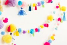 11 a super colorful pompom and tassel garland will cheer up any space