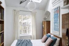 11 additional skylights add more natural light to this small bedroom and make it look bigger