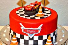 12 a red, black and white birthday cake inspired by Cars