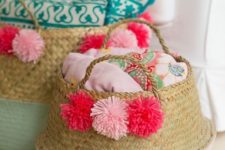 13 a basket for linen with colorful pompoms to make them more summer-like