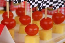 14 appetizers topped with finish flags are a cool Cars-themed starter