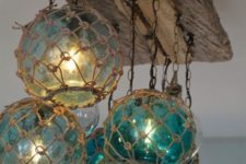 15 oversized fishing floats used for a kitchen lighting fixture