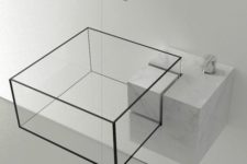02 a modern sheer glass geometric sink with black framing on a marble holder