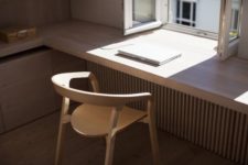 04 a sleek windowsill continued on the sides for a comfy modern workspace
