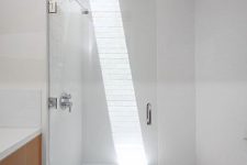 04 just a small skylight makes this white shower space bolder and chic