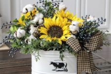 06 a metal bathtub with cotton and faux sunflowers plus a cute bow