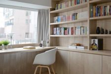 07 a minimalist home office with bookshelves and a windowsill as a desk