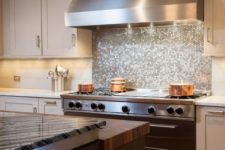 07 shiny silver hex tile backsplash to accentuate the cooker zone