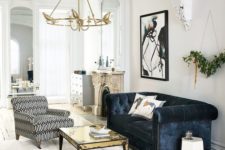 09 a chic space with luxurious touches with a dark blue velvet sofa
