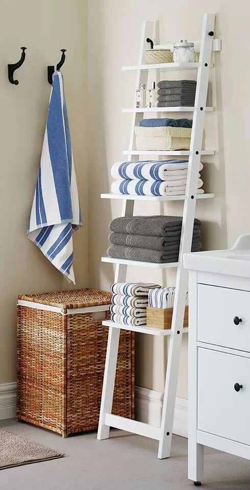 a ladder used for towel and bathroom accessories storage is a space-savvy idea