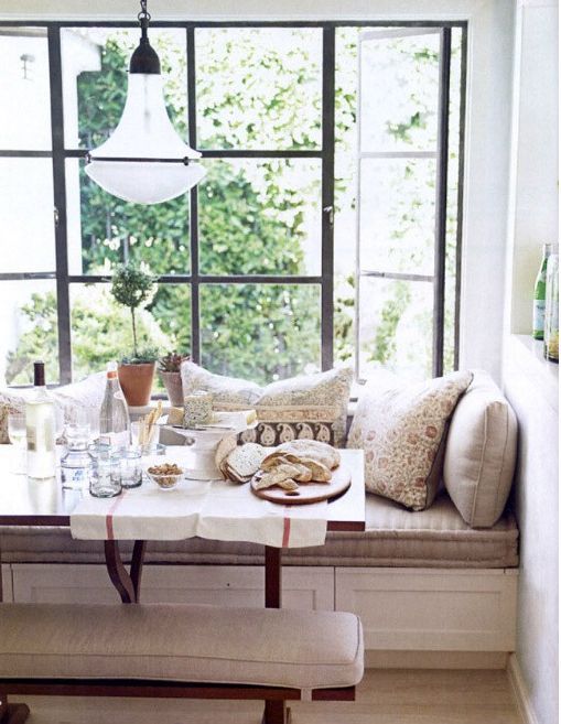 an upholstered window sill bench for a small dining space