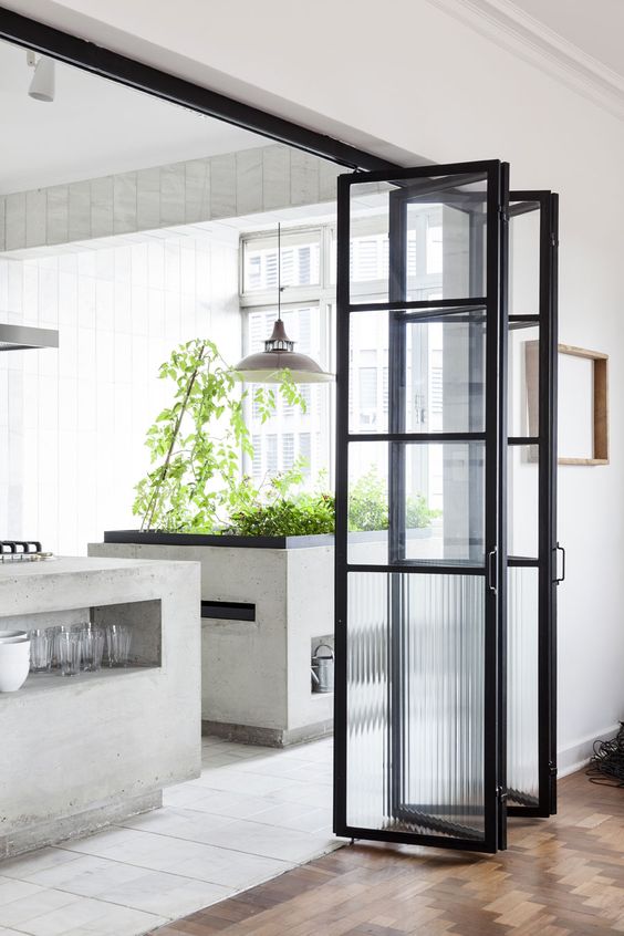 a black framed door to connect the spaces when needed and unite them into one