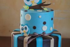 10 a blue and brown owl cake for a boy’s baby shower with bows and ribbons