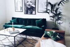 an emerald velvet sofa with matching pillows for a modern living room