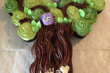 11 a creative tree with purple owls wedding cake made of cupcakes