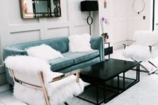 11 an aqua velvet sofa with chic modern lines and a faux fur chair