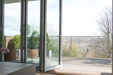 12 a folding door helps to connect the indoors with outdoors without visual borders