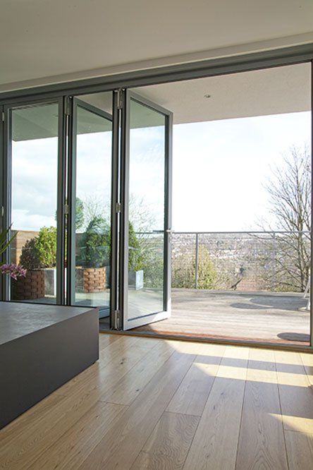 a folding door helps to connect the indoors with outdoors without visual borders