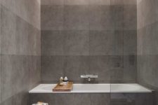 bathroom with only grey tiles