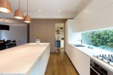 12 matte white kitchen with a window backsplash that shows much greenery