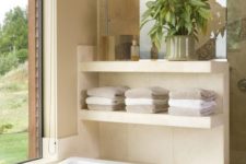 12 stylish open shelving next to the bathtub is a modern and comfy idea