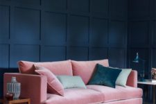14 a navy room is softened with a pink velvet sofa