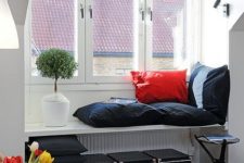 14 a window sill daybed ade of pillows and cushions is an ideal place to sleep