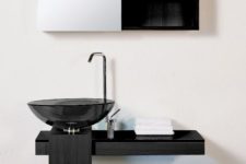 14 an ultra-minimalist bathroom with a smoked glass sink