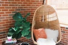 15 a wicker chair, a cozy rug and a potted plant for cozy reading