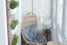 16 a wicker hanging chair with a cushion and a breakfast nook with a foldable table