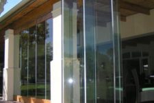 16 this frameless folding door seems to disappear in the air leaving no boundaries betwene indoors and outdoors