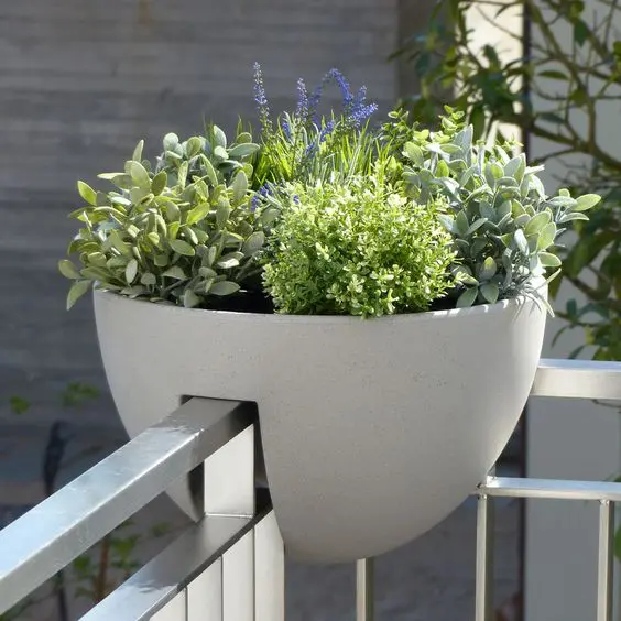 a corner railing planter is a cool way to style your space and refresh it a bit, it won't take floor space