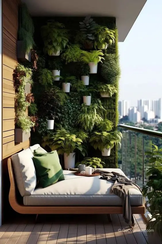 a living wall with planters attached are a great combo for a modern and chic balcony, it looks stylish