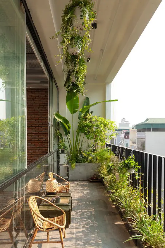 long narrow planters and suspended ones with greenery are a cool way to refresh a balcony and make it cool