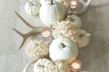 02 a beautiful neutral centerpiece with why hydrangeas, antlers, candles and pumpkins