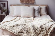 02 a gorgeous white chunky knit blanket for a boho chic bedroom